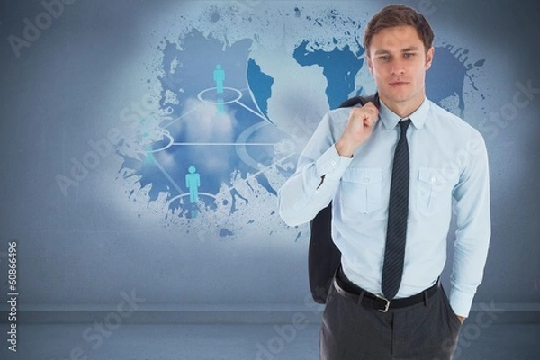 Fototapeta Composite image of serious businessman holding his jacket