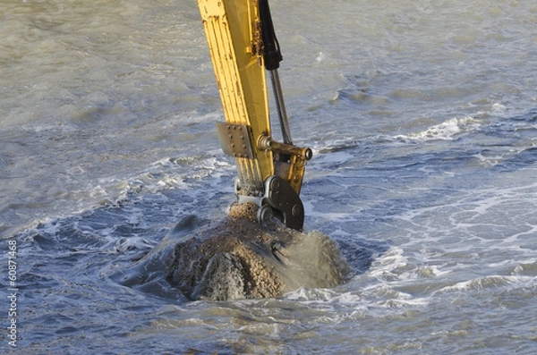 Fototapeta Dredging harbor with excavator