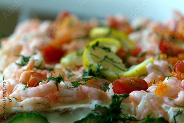 Fototapeta Top ingredients for a smorgas cake shrimp lemon salmon