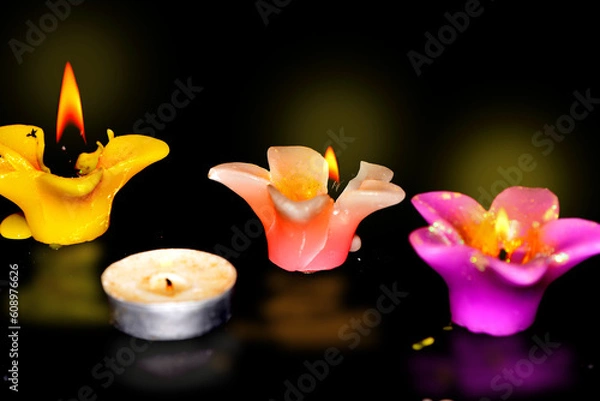 Obraz burning candle on black background