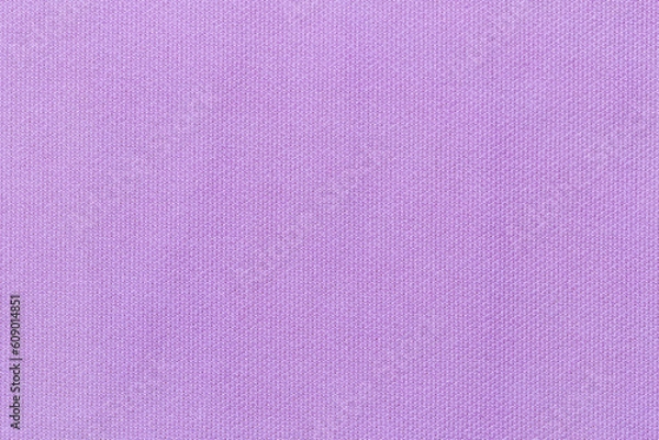 Fototapeta The light purple background from a textile material. Fabric with natural texture.
