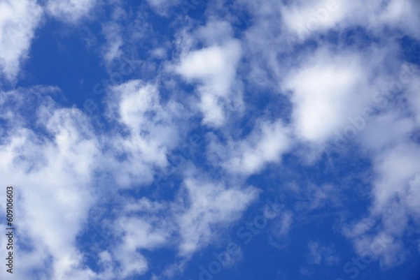 Fototapeta Blue sky with white fluffy clouds.