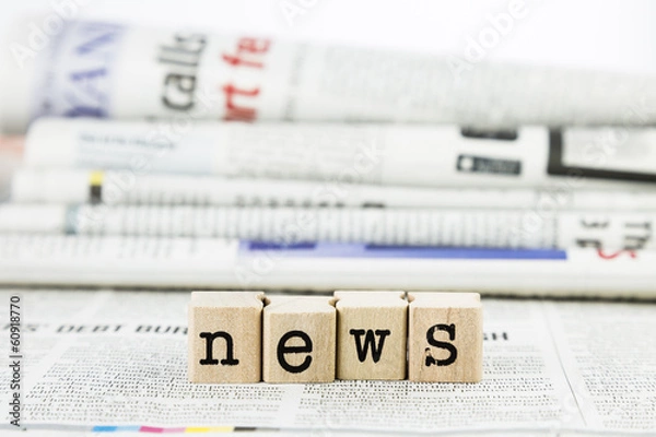 Obraz news wording on newspaper background