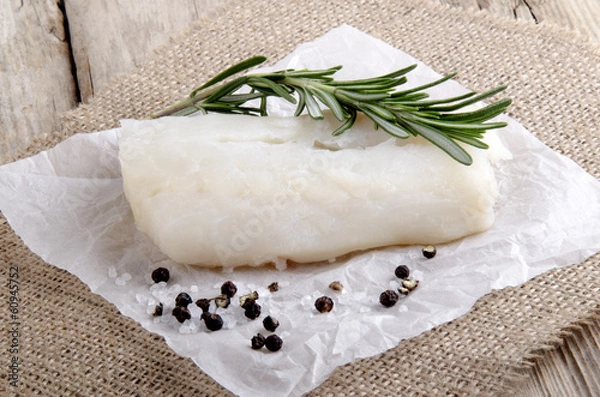 Obraz cod with rosemary on kitchen paper