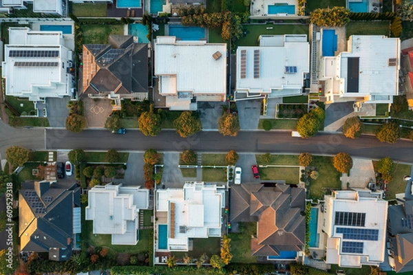 Obraz Top down aerial view of modern upmarket houses with pools and rooftop solar in outer suburban Sydney, Australia.