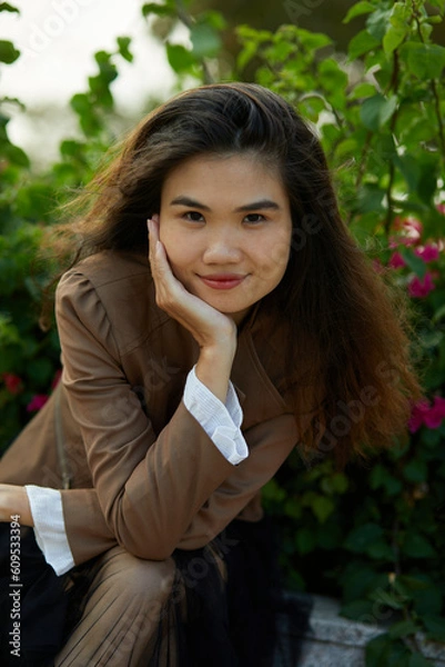 Obraz Vietnamese woman in the park during lunchtime in Vietnam.