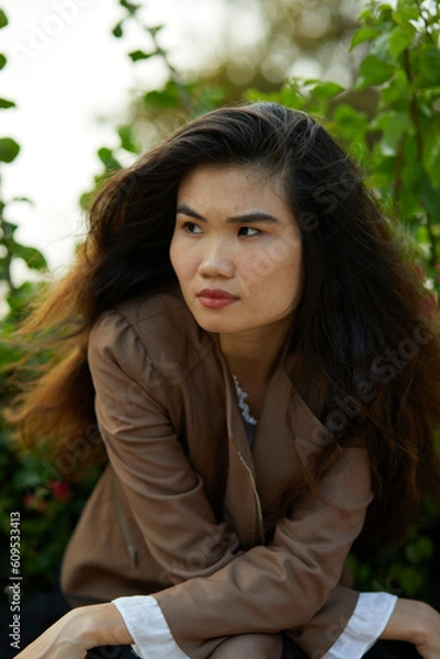 Obraz Vietnamese woman in the park during lunchtime in Vietnam.