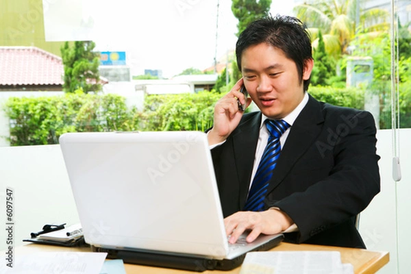 Obraz Talking on the phone while break time in cafe