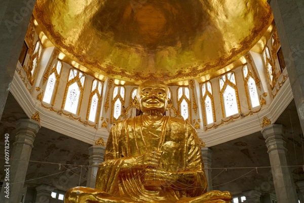 Fototapeta Luang Pho To Temple, a large body, a large building, a place of merit making for Buddhists At Sikhiu District, Thailand 16-05-2023