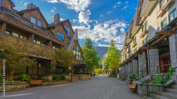 Fototapeta Solitude at picturesque Whistler Village in the calm of early morning, with mountain backdrop.