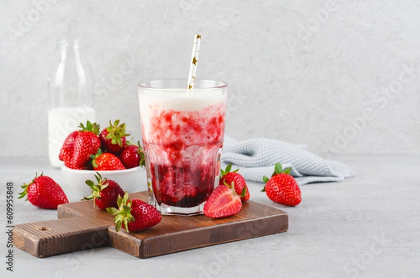 Fototapeta Korean Strawberry Milk, Strawberry Milkshake with Pureed Fresh Berries, Refreshing Drink on Bright Background