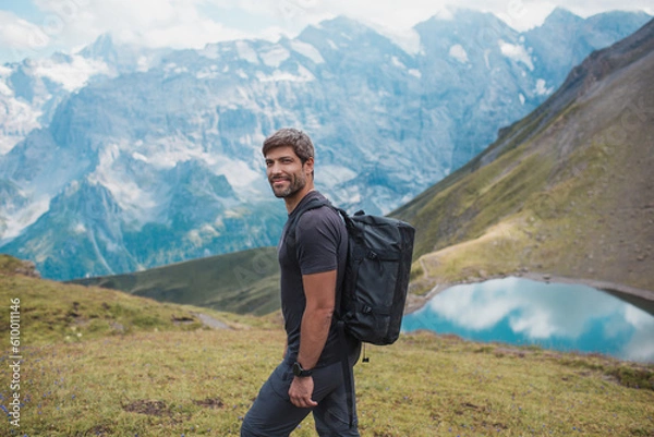 Obraz Young man hiking in Switzerland mountains