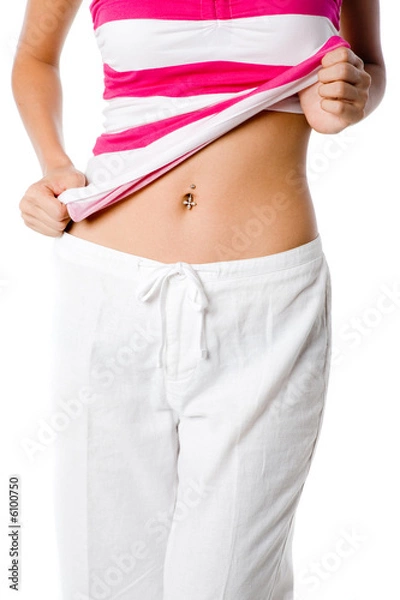 Obraz A woman shows off her belly button piercing