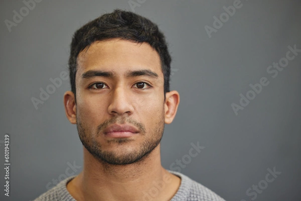 Fototapeta Serious man, casual and portrait with modern confidence in a studio with closeup. Male model, grey background and young person face from Philippines of a handsome Asian adult with attitude alone