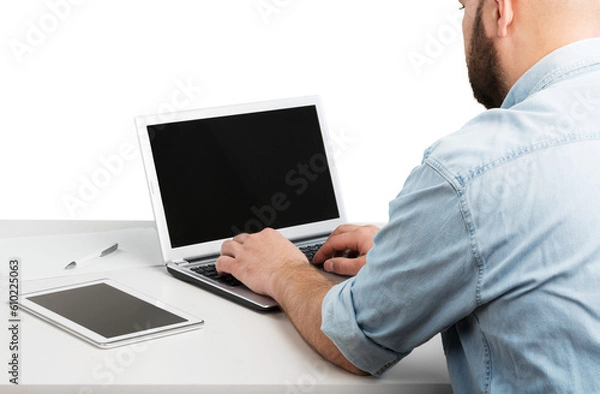 Fototapeta Man using new laptop with touchbar lying on table