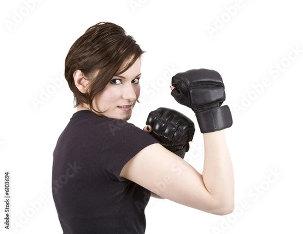 Obraz Brunette woman in boxing attire smiling at the camera.