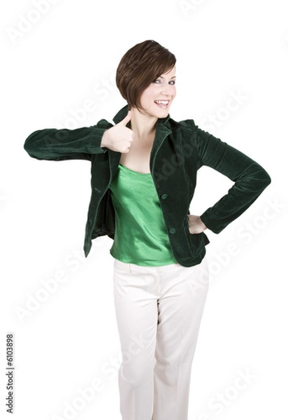 Obraz Beautiful Brunette In Green Smiling And Giving Thumbs Up