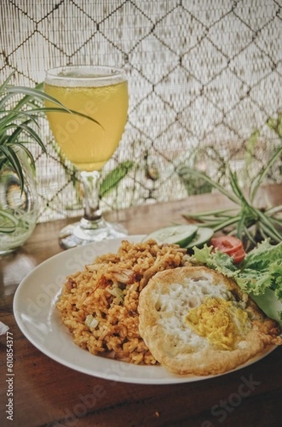 Obraz time to take a break for lunch, orange juice and eat fried rice and flour chicken and crushed with Indonesian chili sauce
