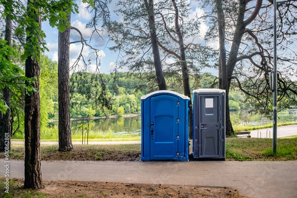 Obraz Two portable toilets in a park