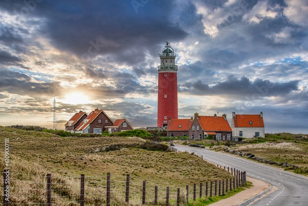 Obraz Lighthouse on the Wadden Island of Texel, Netherlands at sunset, dramatic sky