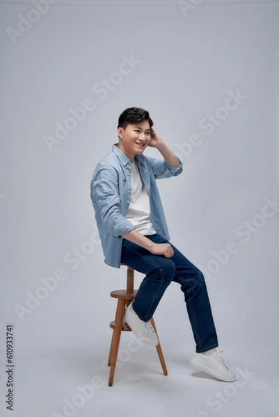Fototapeta man sitting on a bar stool