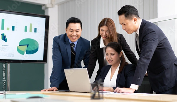 Fototapeta Business mentor meeting with team in office looking at computer screen training management concept. Asian businessman work together with executive colleague group talking mentoring leadership idea.