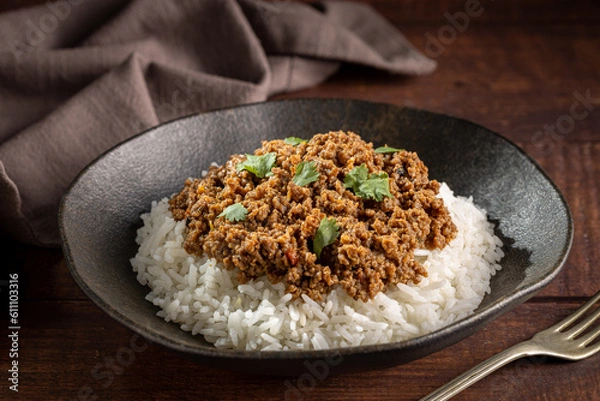 Obraz Rice with minced meat on the plate.