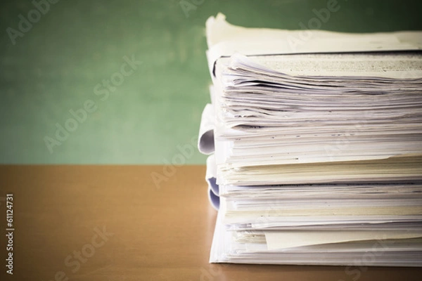 Obraz stack of paper on blackboard