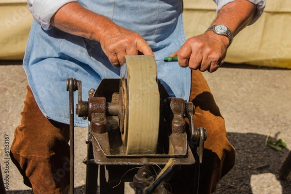 Fototapeta The knife-sharpener