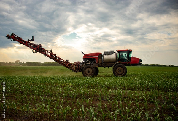 Obraz Red sprayer in a field of corn