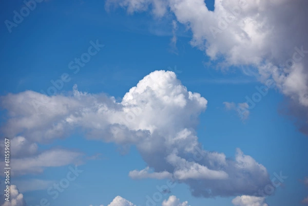 Fototapeta Heaven, space and environment with clouds in blue sky for nature, peace and climate. Sunshine, mockup and dream with fluffy cloudscape in ozone air for freedom, pattern and weather meteorology