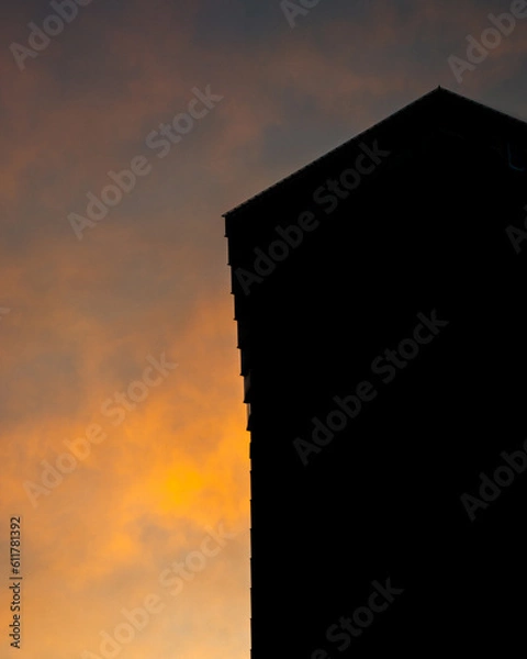 Obraz A silhouette of skyscrapers against a sunset backdrop