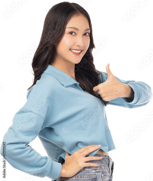 Fototapeta Smilling Young asian woman showing and giving thumb up to camera standing over isolated on white background copy space Beautiful customer girl get satisfied product on sale or discout Enjoy lady 