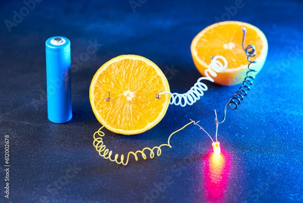 Fototapeta Free energy electricity generator using oranges.