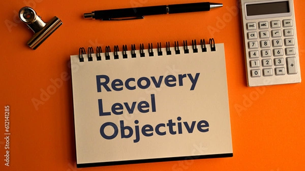 Fototapeta There is notebook with the word Recovery Level Objective. It is as an eye-catching image.