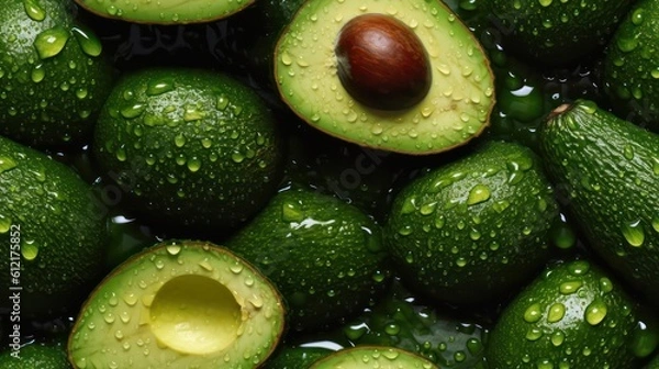 Fototapeta Many fresh avocado background adorned with some droplets of water for food magazine photography generative ai
