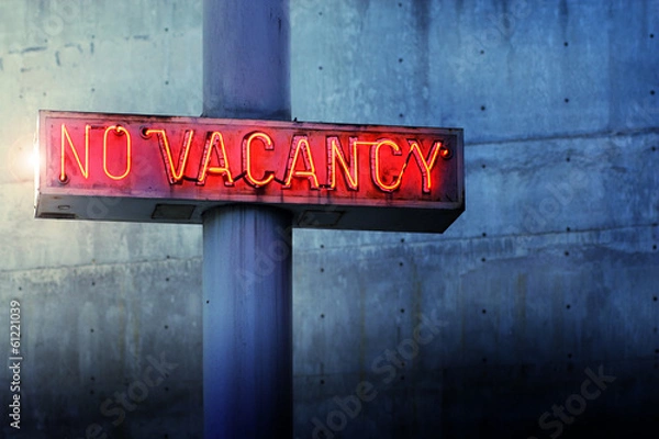 Obraz Glowing retro neon 'no vacancy' sign against blue wall