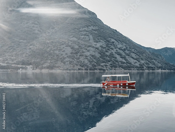 Obraz Red boat in the sea floats on azure water 
