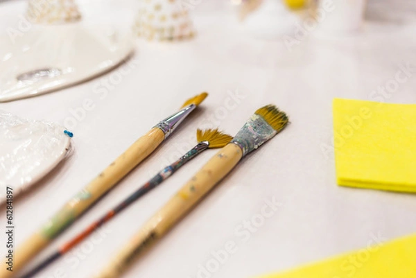 Obraz Paintbrushes are lying on the table