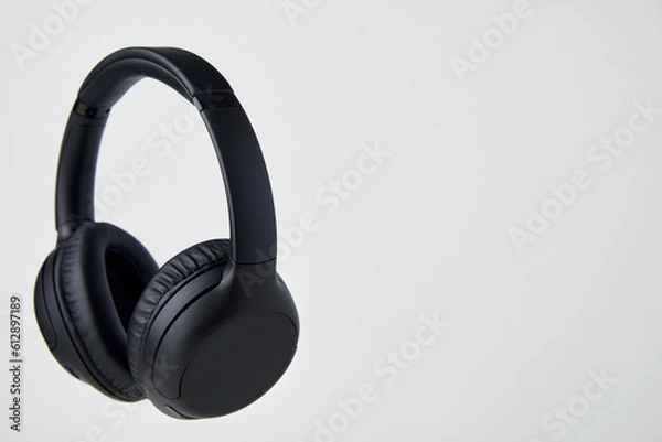 Obraz Black Wireless Headphones Floating in Studio - Stock Photos.