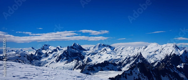 Fototapeta Snow Mountains Sunlight Build Wallpaper. Generative AI