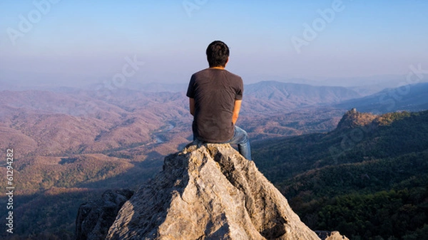 Obraz man on rock at mountain