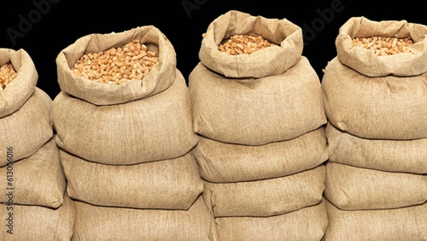Fototapeta Pile of sacks in a row ful with wooden pellets - generative ai