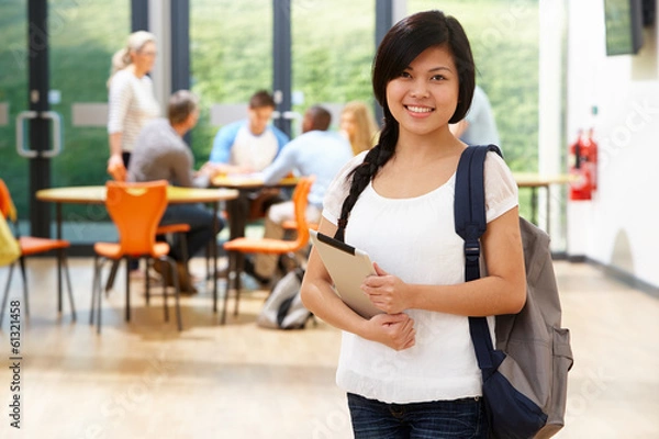 Obraz Portrait Of Female Student In Classroom With Digital Tablet