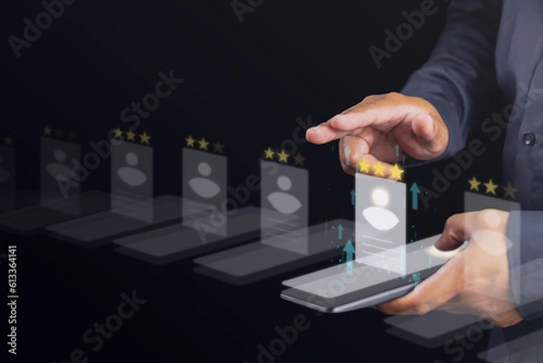 Obraz Recruitment concept. Human Resource Manager chooses new people to join an organization or support a cause. CV holograms are happened on smartphone.