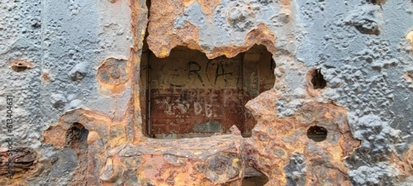Obraz old rusty door hole