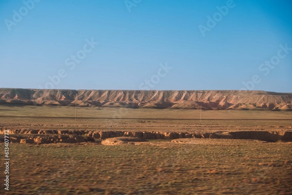 Obraz cloudless sunny morning in the Kazakh steppe with hills