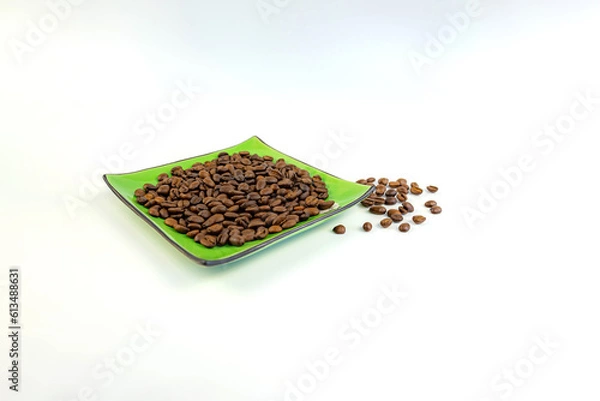 Fototapeta Coffee beans on a green square saucer, white background
