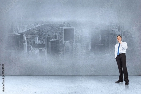 Fototapeta Composite image of thinking businessman touching chin