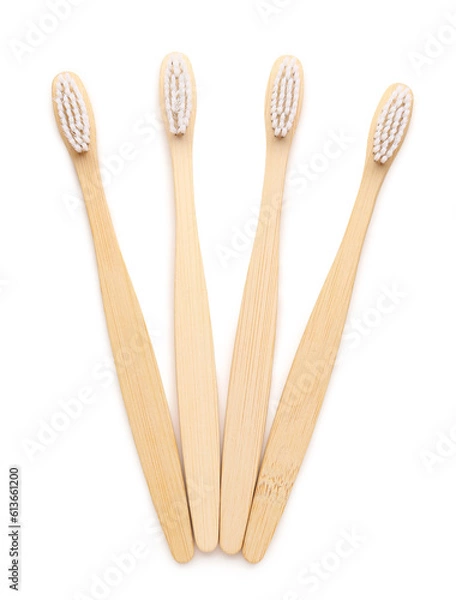 Obraz Many bamboo toothbrushes on white background
